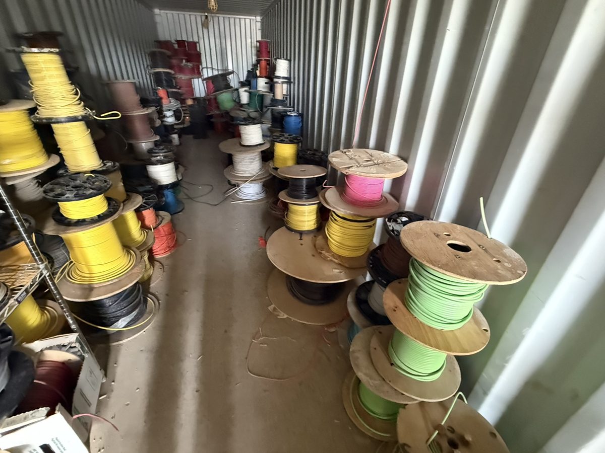 Assorted wire spools loaded in a container