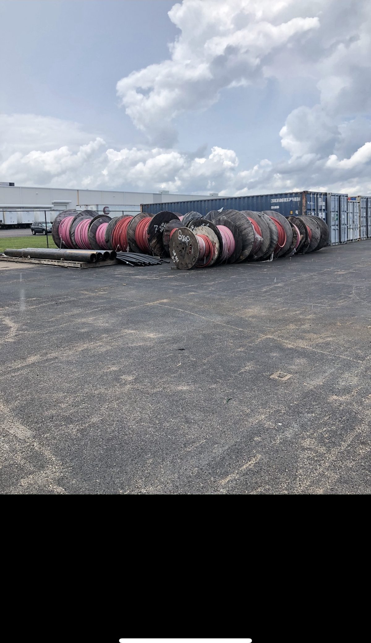 Surplus wire reels in a contractor yard